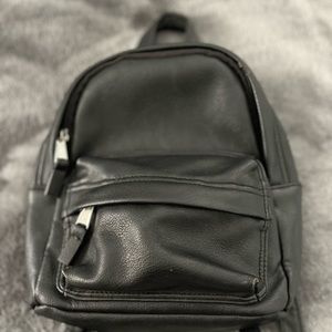 Black faux leather mini backpack!